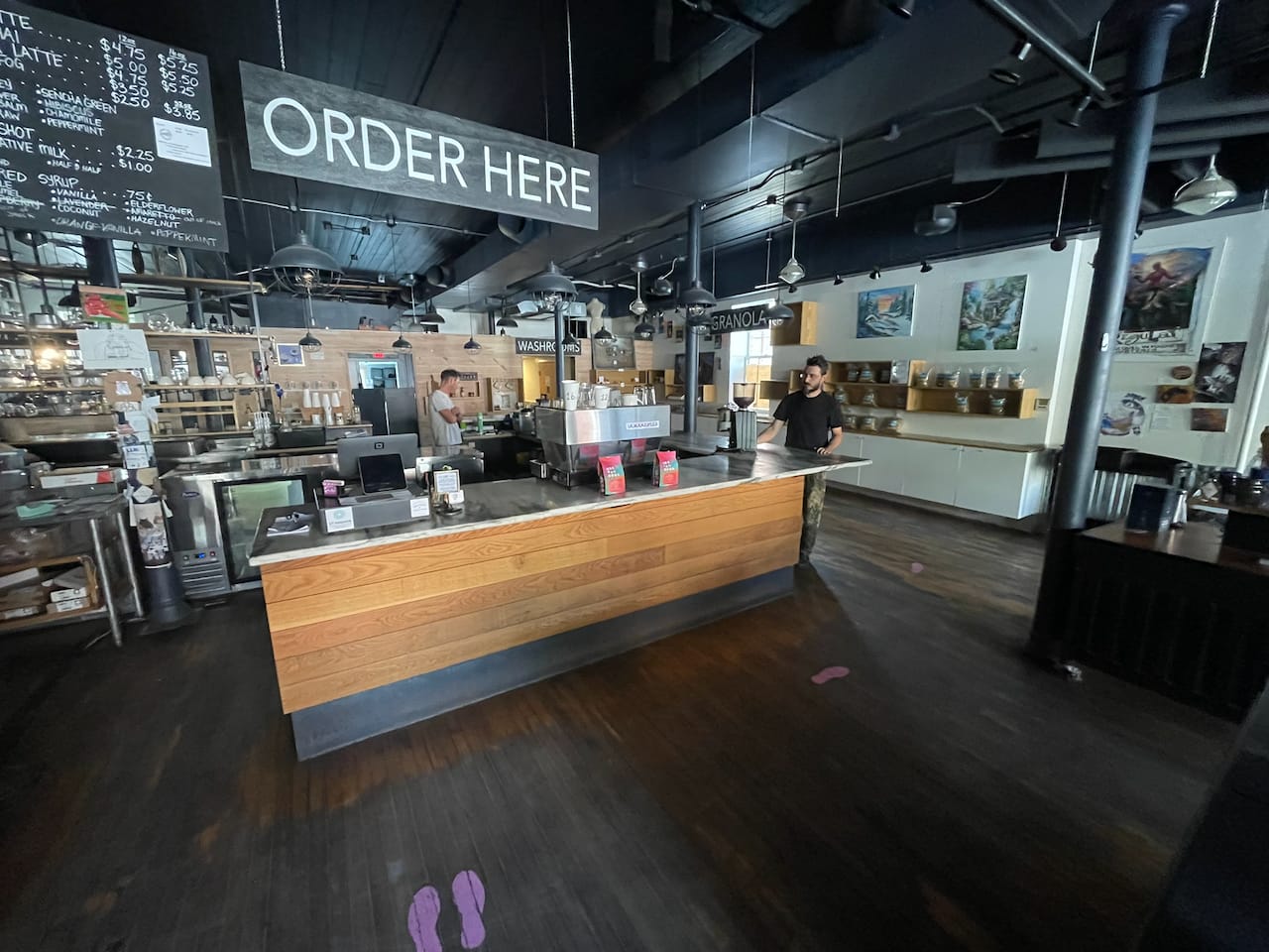 The room came dark-floored, with the last tenant’s order counter still standing.