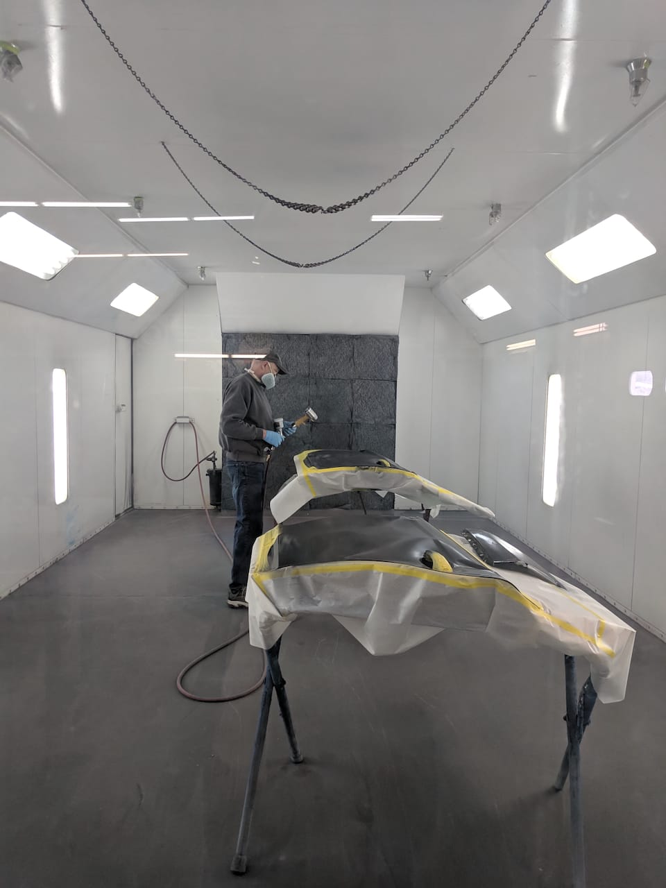 The car door being painted.