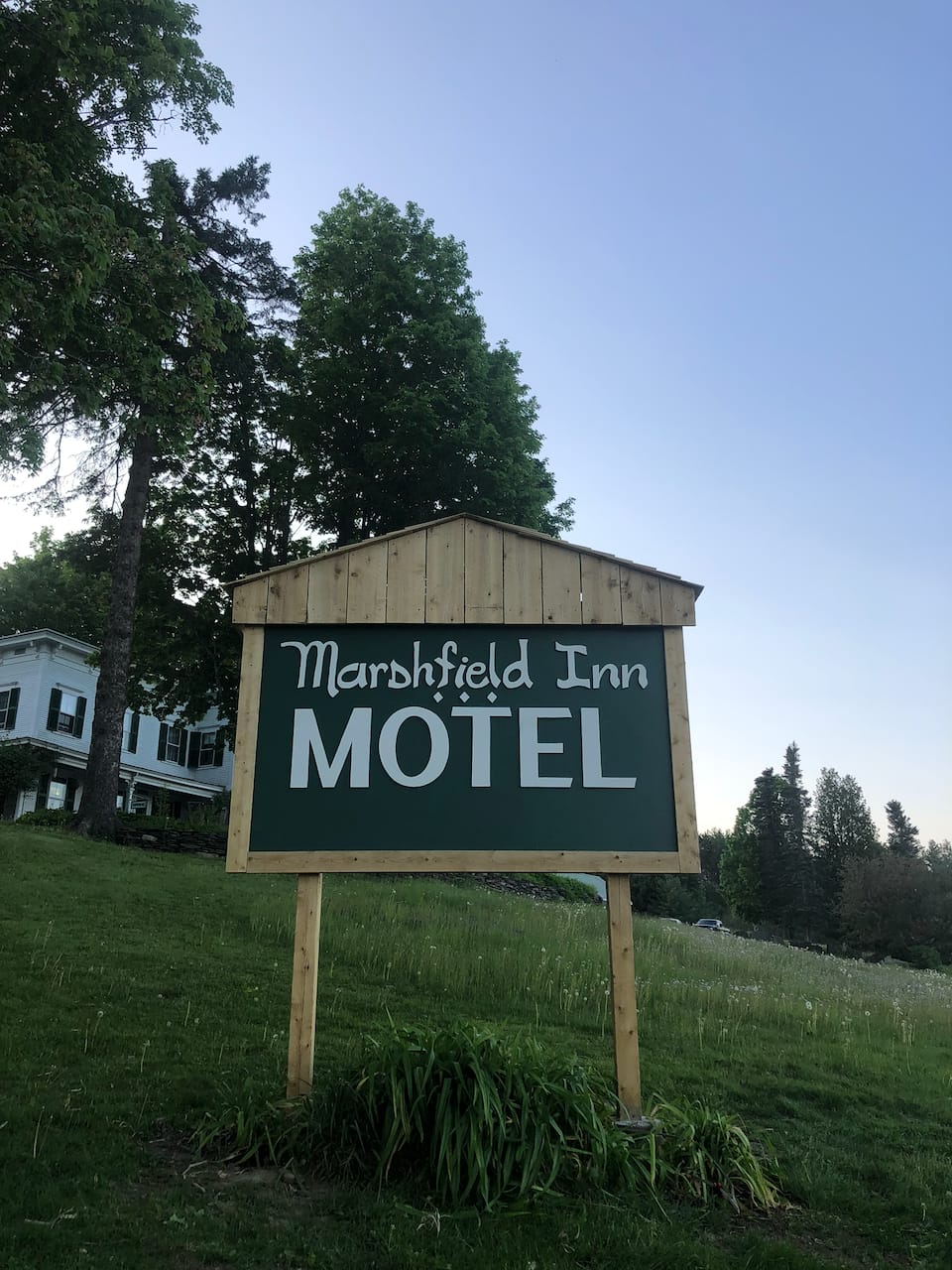 One of the two remade signs for the Marshfield Inn & Motel, installed on the roadside.