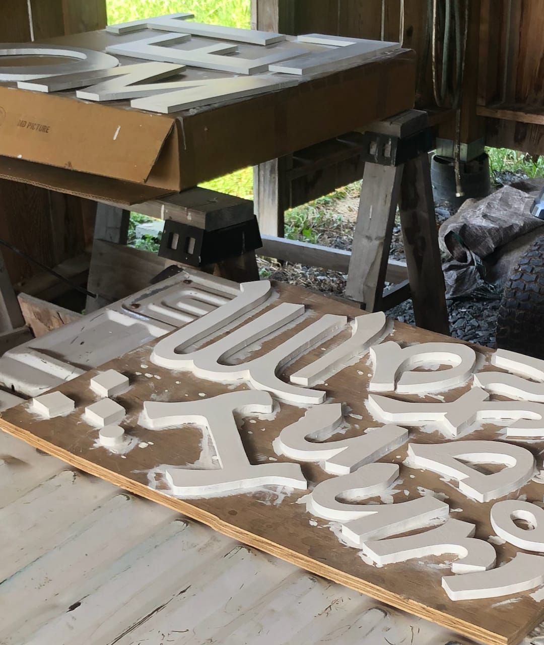 The recreated letters, cut and primed.