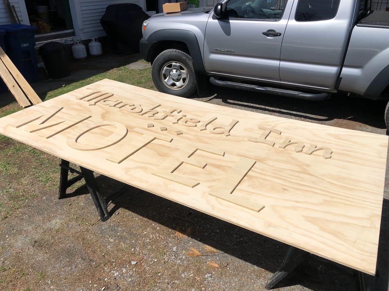 The recreated lettering on the new sign board.