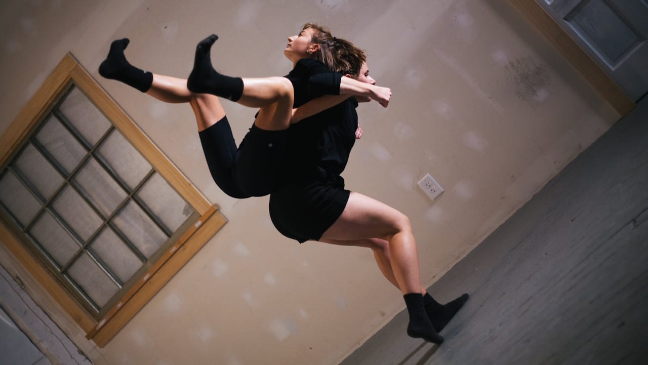 Two dancers in a lift.