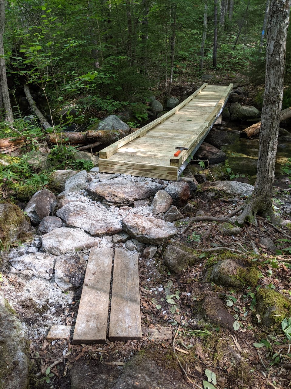Rock work leading up to another bridge.